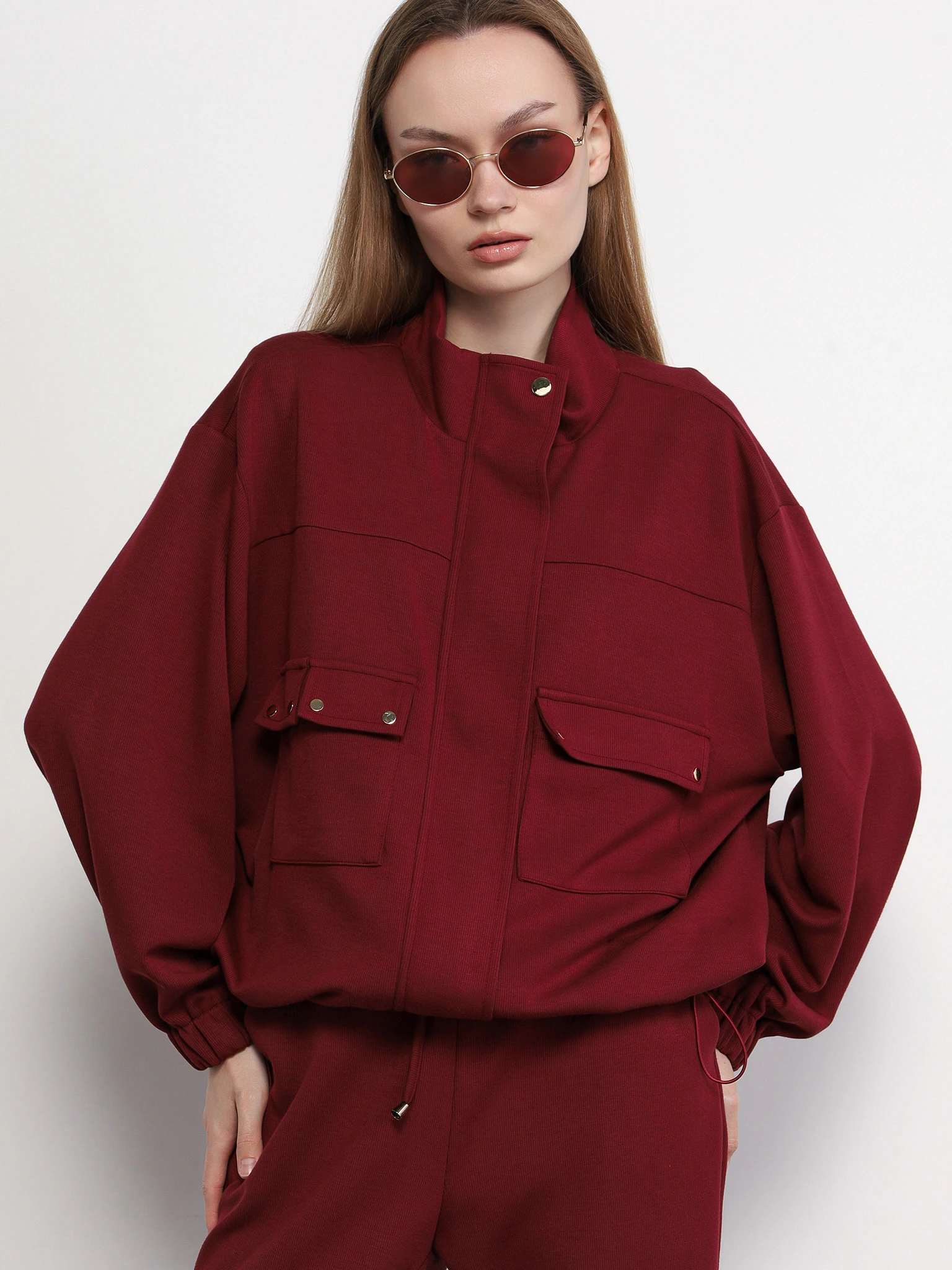 Куртка трикотажная бордового цвета с кулиской по низу